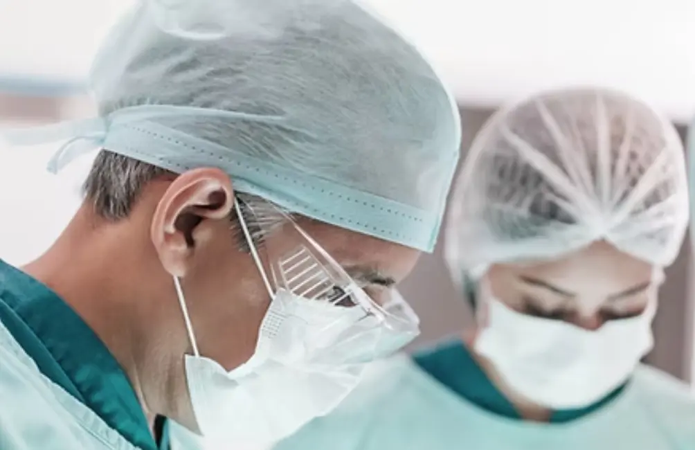 Surgical team wearing face masks during an operation